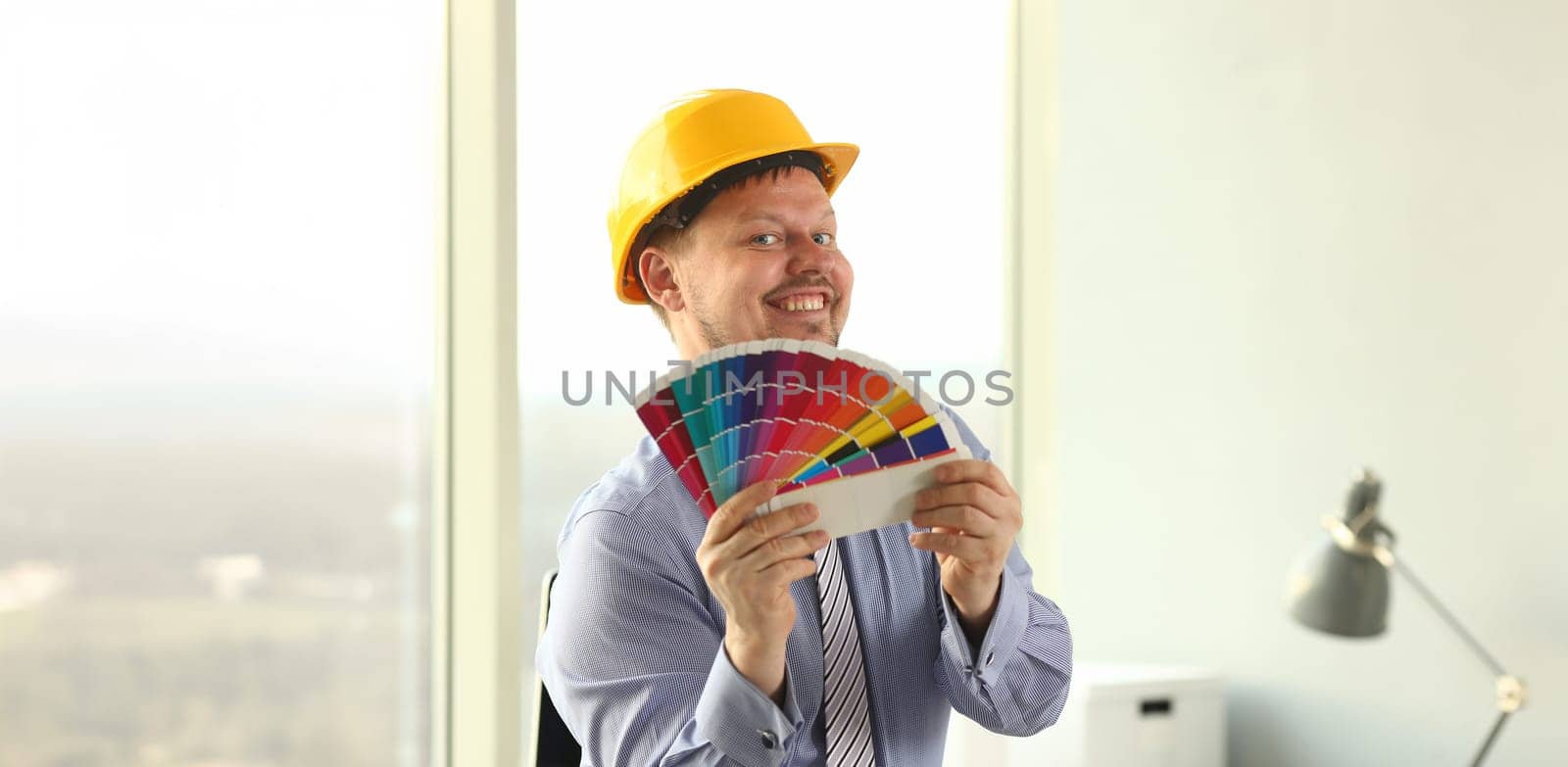 Graphic Designer Holt Architectural Color Palette. Engineering Creative Office. Colour Swatches, Samples for Selection. Interior Decoration and Technology Concept. Man in Yellow Hard Hat
