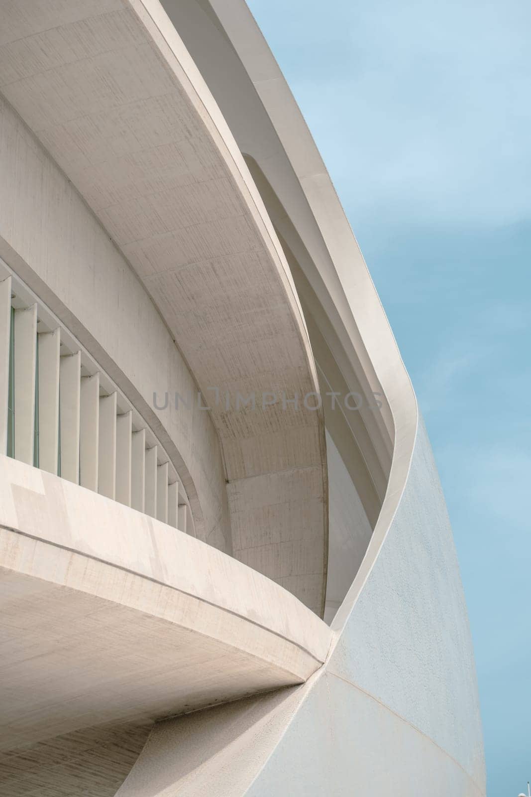 Close-up of a building showcasing architectural curves and lines. The design elements reflect modern urban architecture and innovative construction techniques.