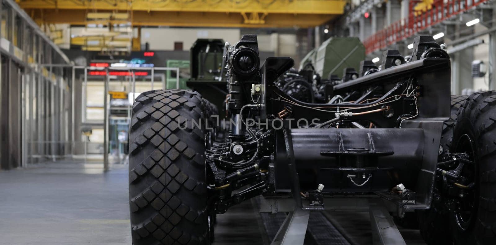 Close-up of coupling joint washers on cross of automobile cardan shaft. Mechanical parts of auto steering system repaired in modern workroom. Car repairing workshop concept