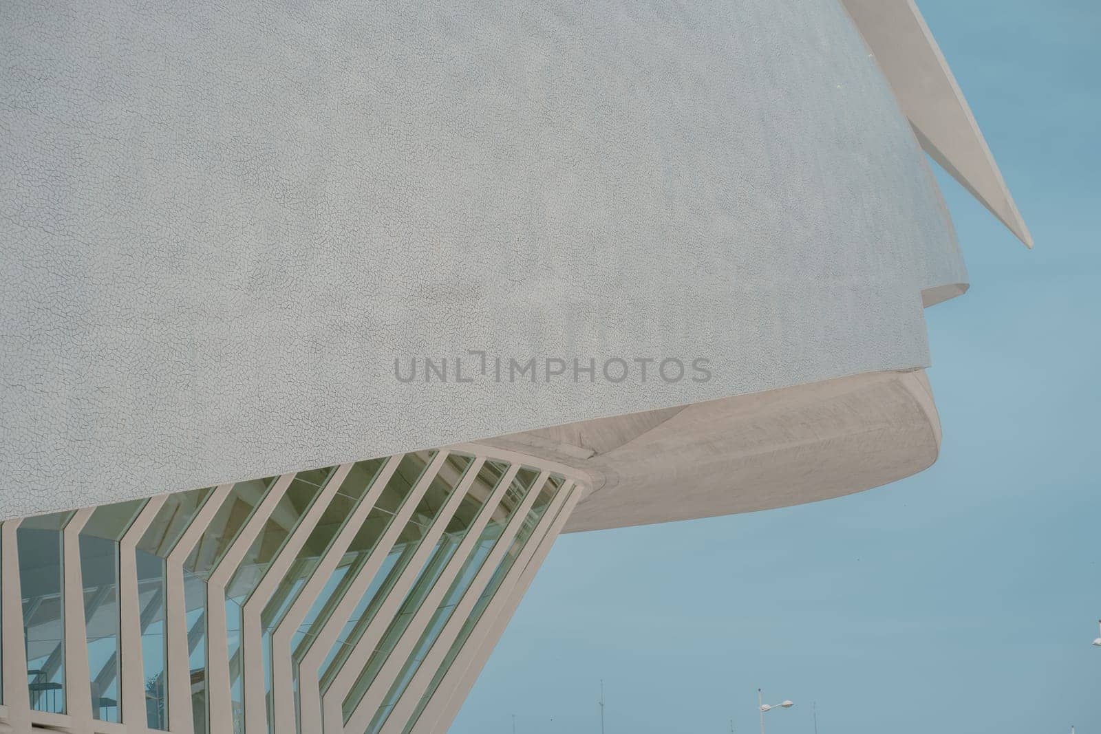 Detailed view of a building innovative facade with large windows and intricate design elements. The modern architecture highlights structural creativity and functionality.