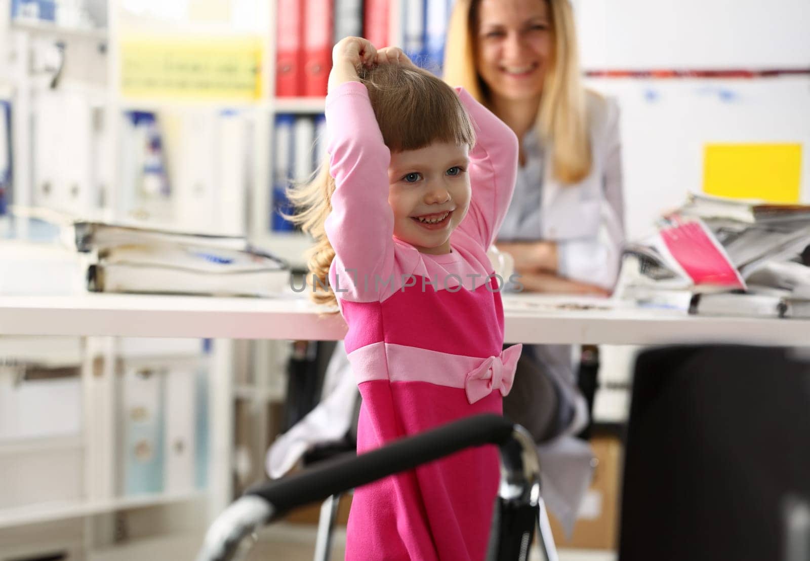 Little happy child at pediatrician reception.