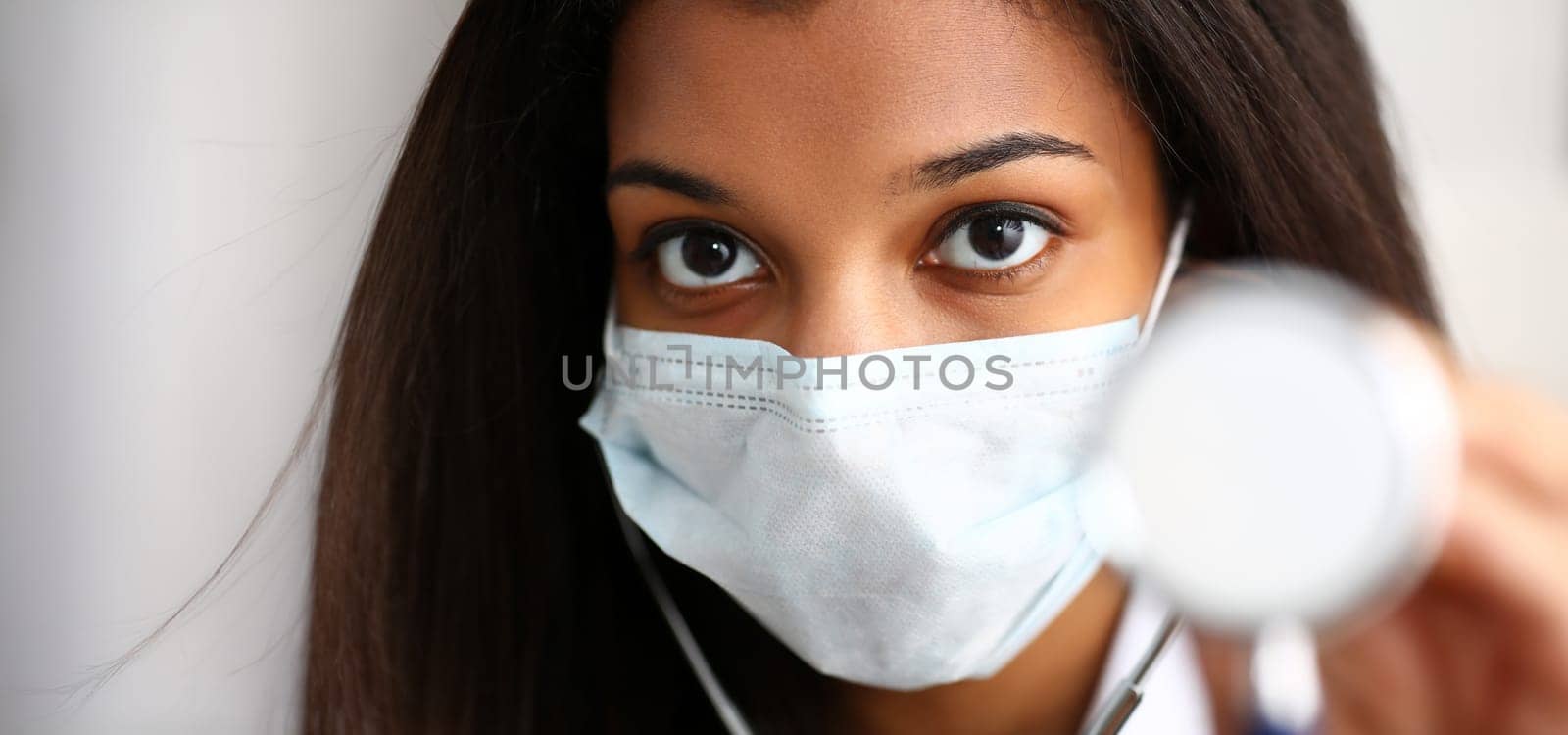 Black female doctor in a face mask. Physical and disease prevention, patient aid exam visit 911 ward round prescribe remedy healthy lifestyle consultant profession concept