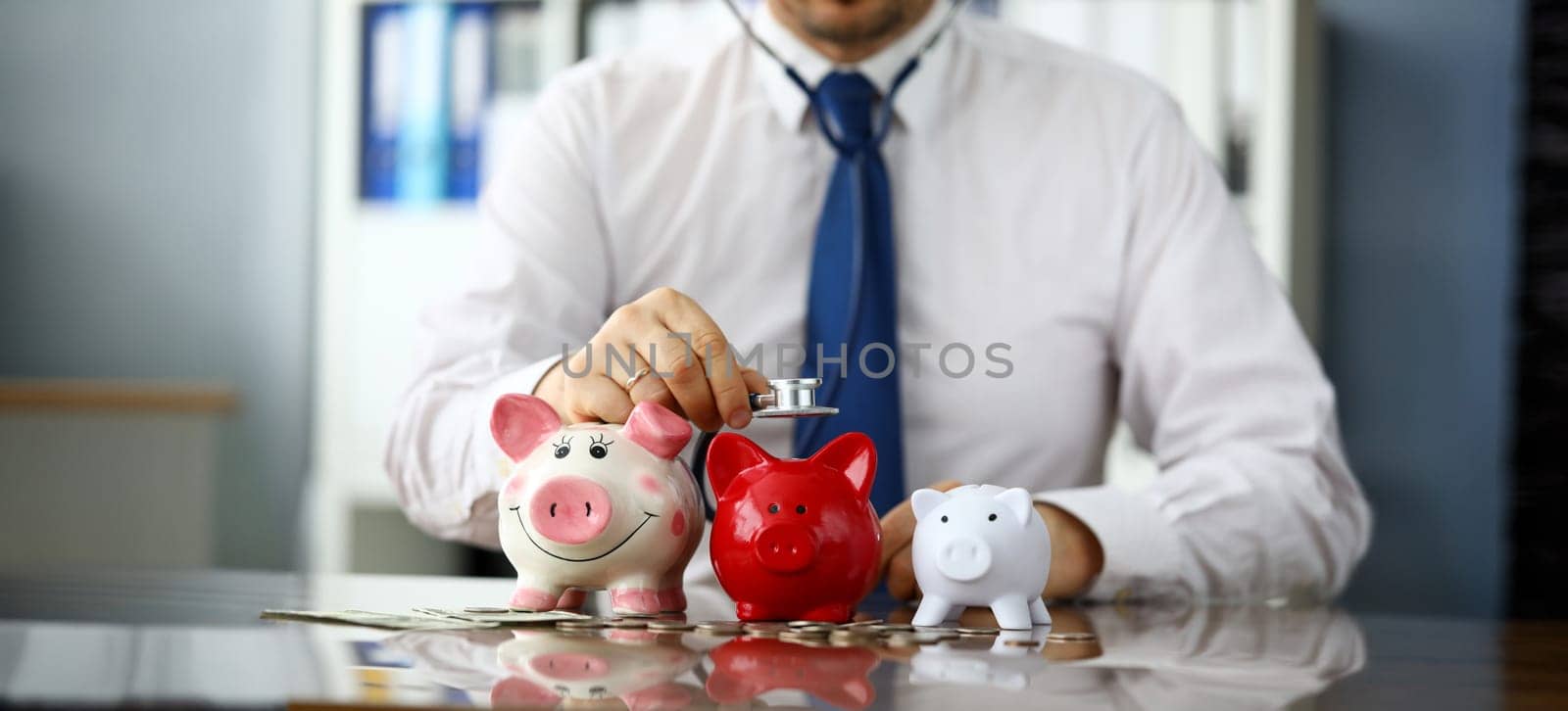 Businessman in tie listen three piggybanks for cash close-up. Business partners searching concept