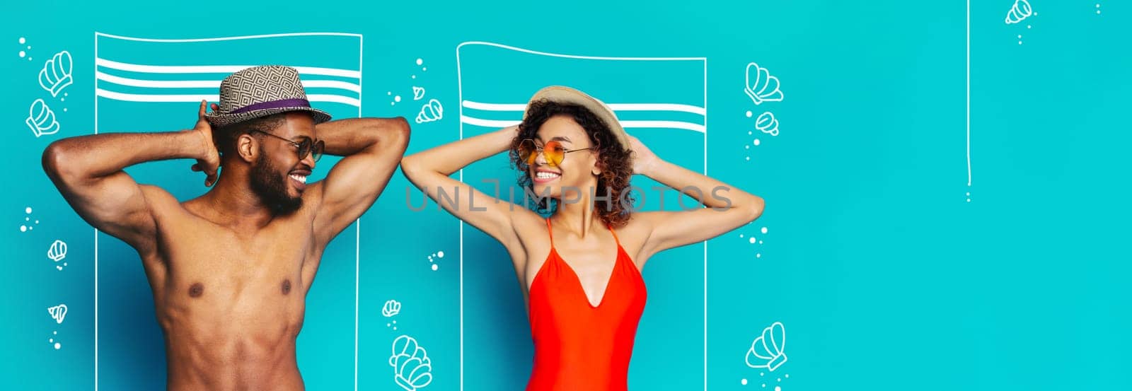 African American smiling man and woman are wearing hats and sunglasses, standing in front of a turquoise background with white drawings of beach towels and seashells, copy space