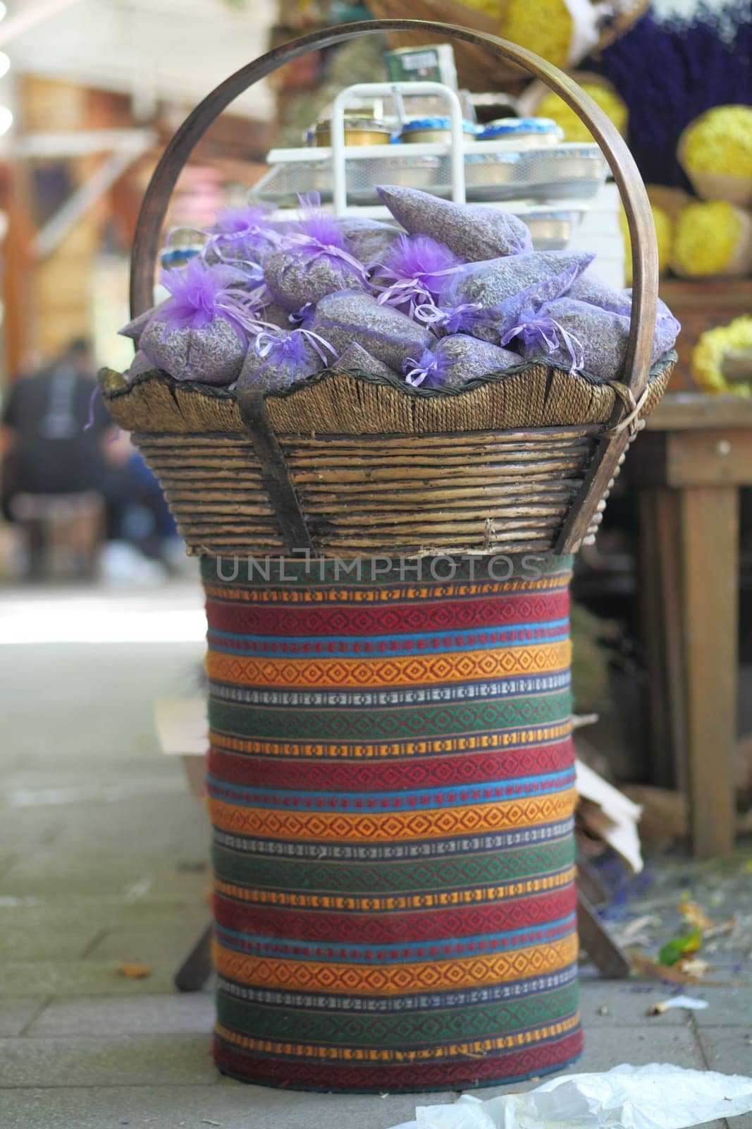Pouch with lavender in a wooden basket