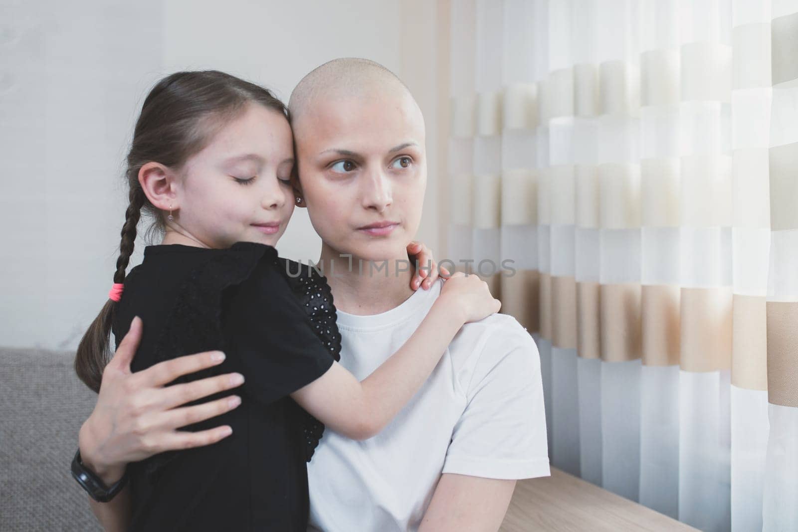 Young woman with cancer returned home to her family after another chemotherapy. Family support concept.