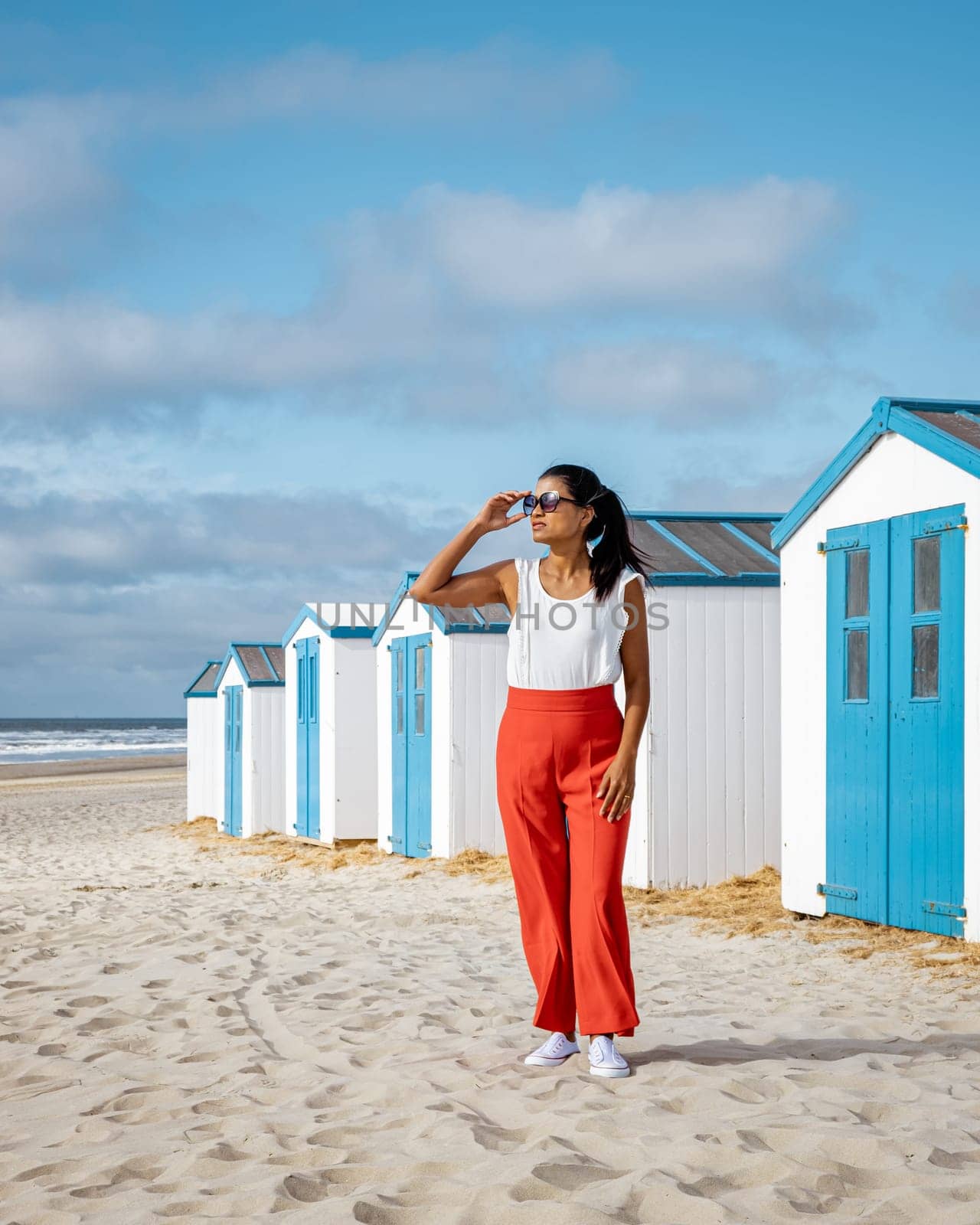 white blue house on the beach Texel Netherlands, beach hut on the Dutch Island of Texel by fokkebok