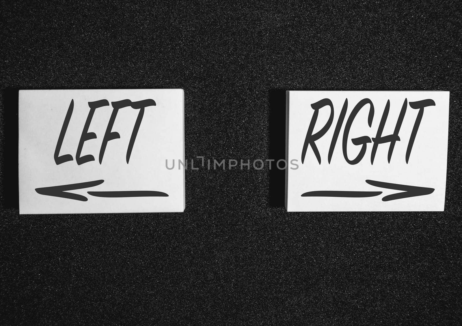 Two  sticky notes on a black background with left and right.