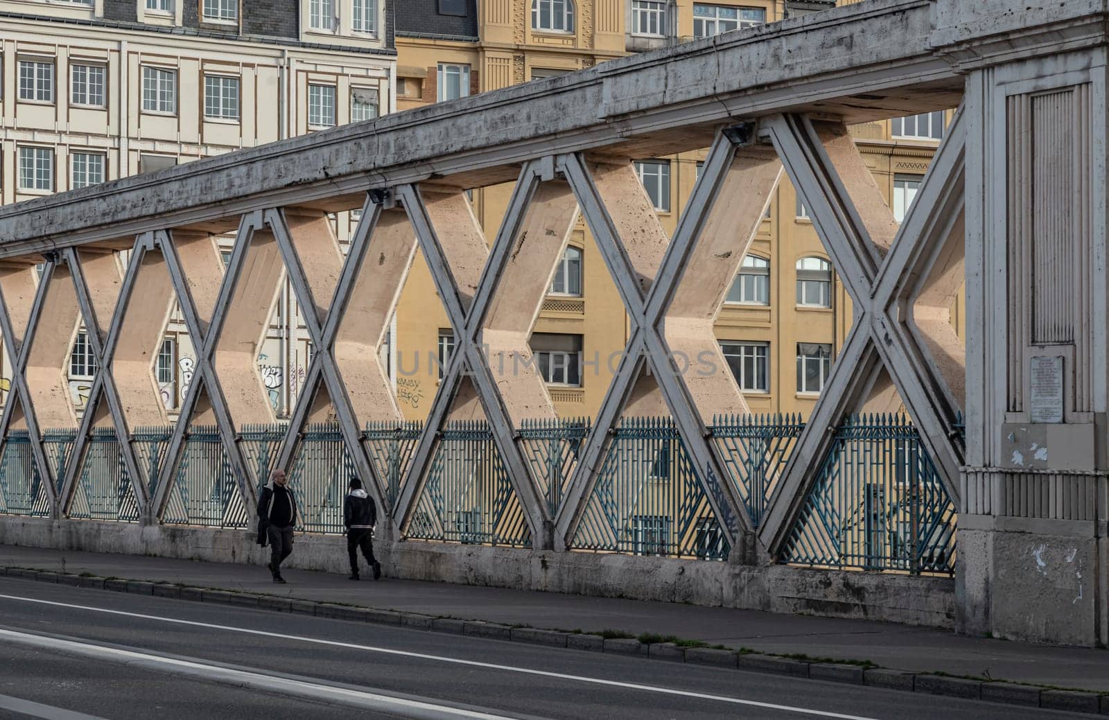 France, Paris - Jan 05, 2024 - People walking along a Bridge on Rue La Fayette. Bridge built above the railways of gare de l'Est, Pont de Lafayette, Rue de l'Aqueduc, Space for text, Selective focus.