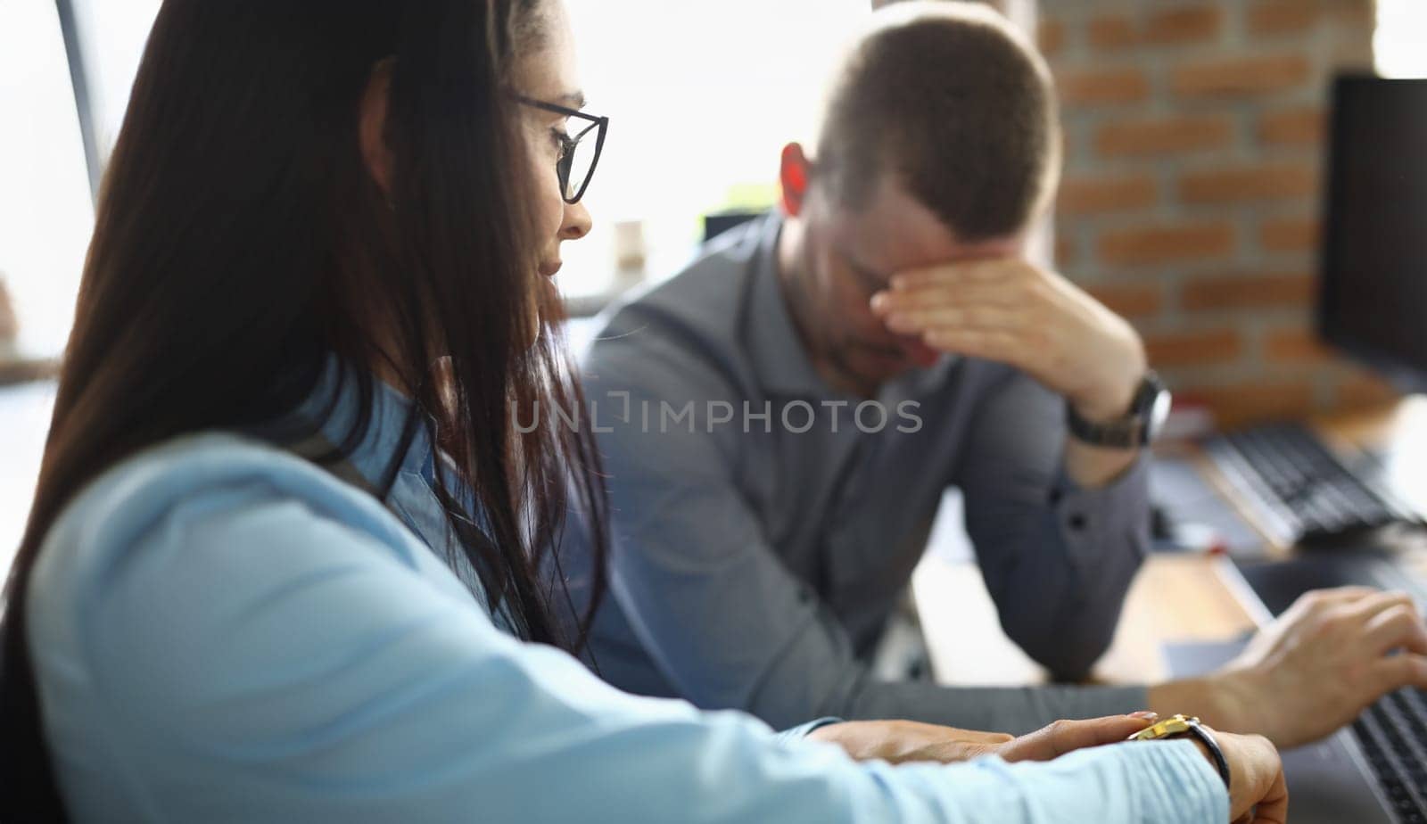 Close-up of businesswoman pointing at time to latecomer colleague. Manager failed to complete task on time. Lateness, unpunctuality, deadline for time management