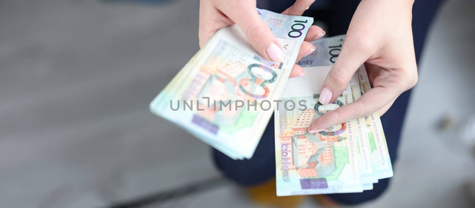 Close-up of woman hands counting ruble money, business and finance. Inflation and depreciation, default. Savings and banking concept