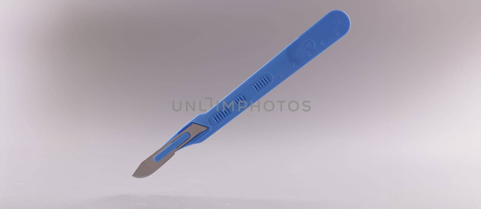 Close-up of scalpel, surgical stainless steel metal instrument on grey background. Knife with small, sharp, detachable blade, using by surgeon. Medical tools