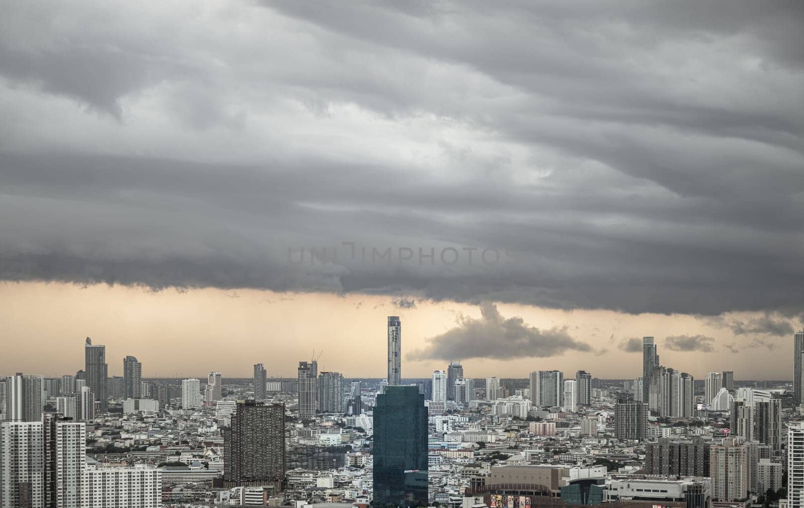 Bangkok, Thailand - 20 Jun, 2024 - Aerial view of skyscrapers and dramatic sky before sunset. Beautiful clouds in the sky over large metropolitan city of bangkok, Space for text, Selective focus.
