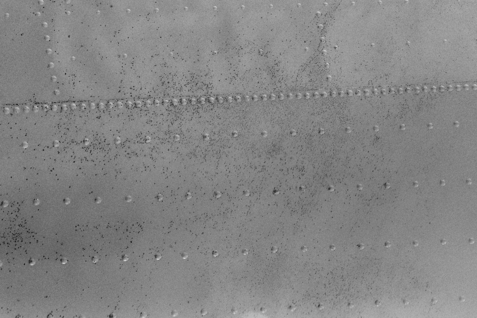 Riveted metal texture background in gray color.