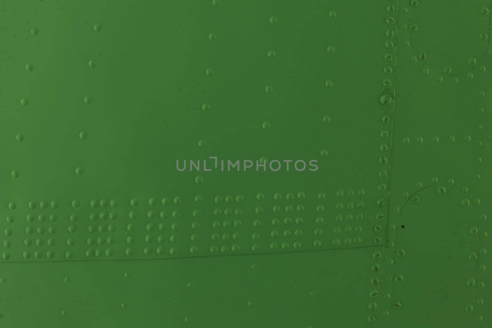 Surface of sheet metal with rivets. Airplane fuselage.