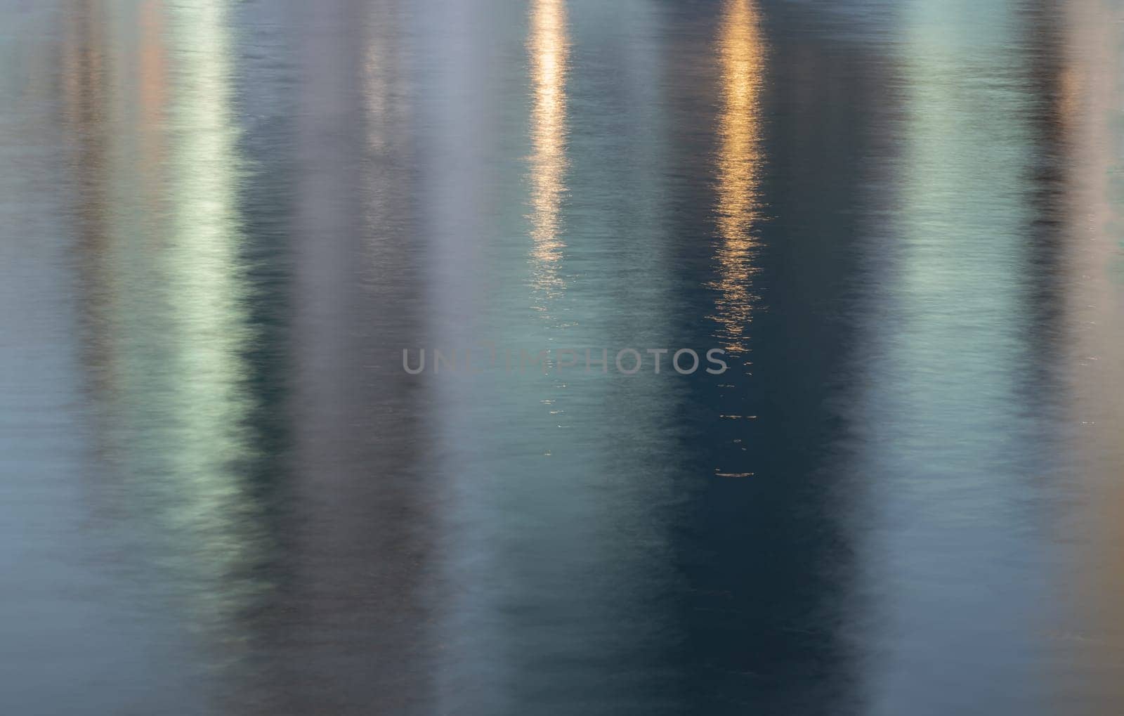 Abstract photo art Reflection in water surface. Ripples on the water of a lake with light reflections, Water wave background, Copy space, Selective focus.
