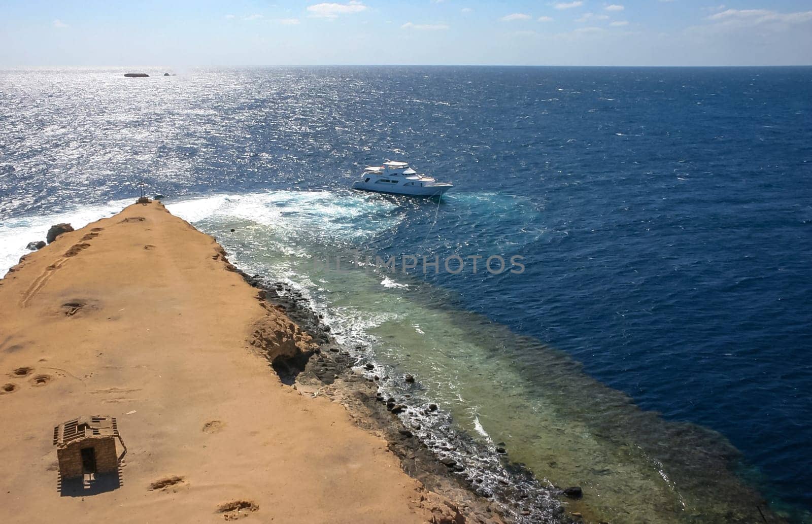 Big Brother Island, Egypt - April 10, 2007: tourist yachts near the coastal reef of Big Brother Island in the Red Sea, Hurghada area
