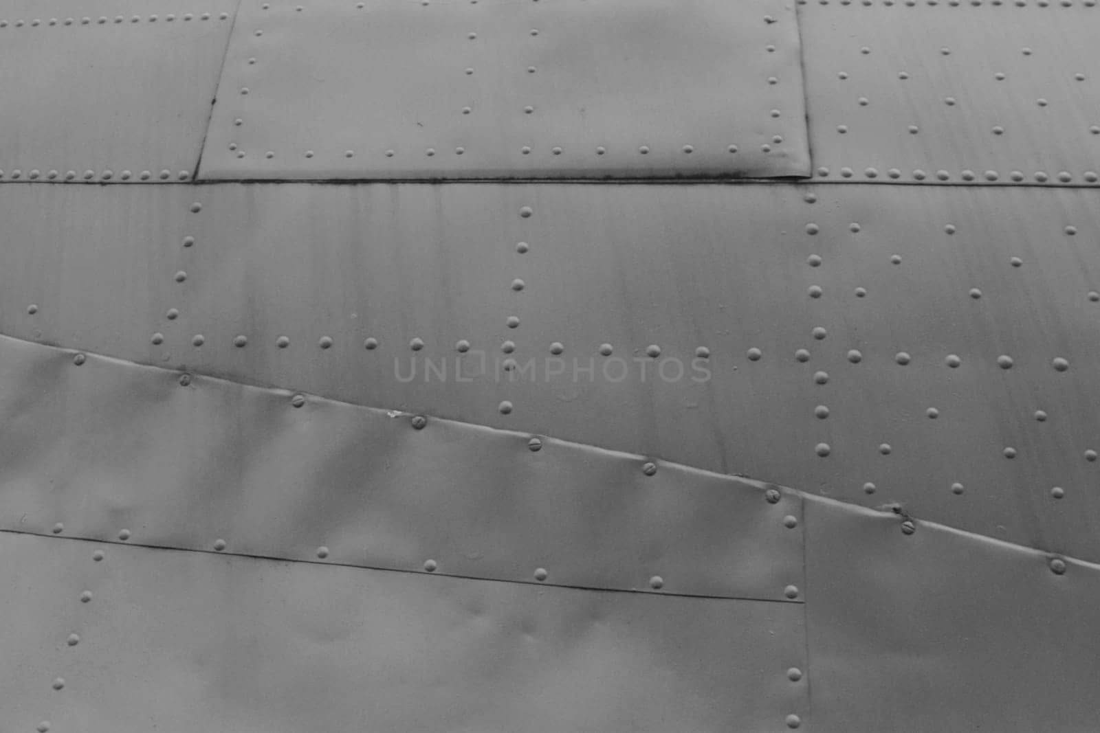 Metal trim with rivets. Military armor in green.