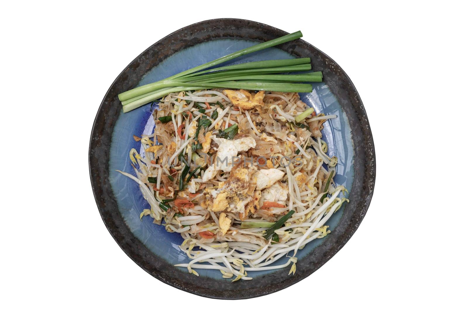 Traditional Fried Thai Noodles (Pad Thai) with Egg, Fried tofu, Dried shrimp, Bean sprouts, Chives and Roasted peanuts on Ceramic plate isolated on white background with clipping path. That popular food for foreigner tourists. Top view, Selective focus.