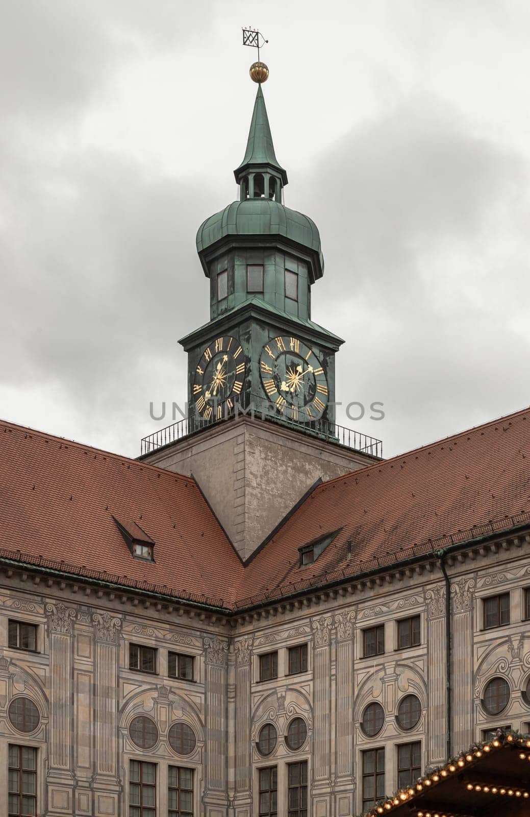 Munich, Germany - Dec 21, 2023 - Exterior View of Clock tower Munich Residenz munich in Renaissance baroque style with sky background. Festival Hall Building, Space for text, Selective focus.