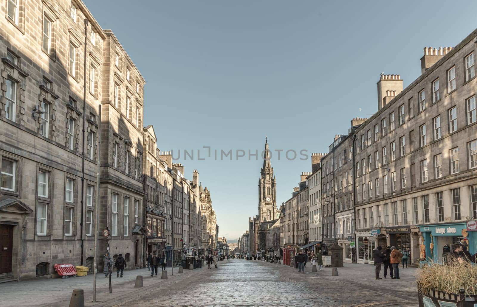 Edinburgh, Scotland - Jan 18, 2024 - People are walking down the High Street on the Royal Mile in Edinburgh City Center Old Town. Space for text, Selective focus.