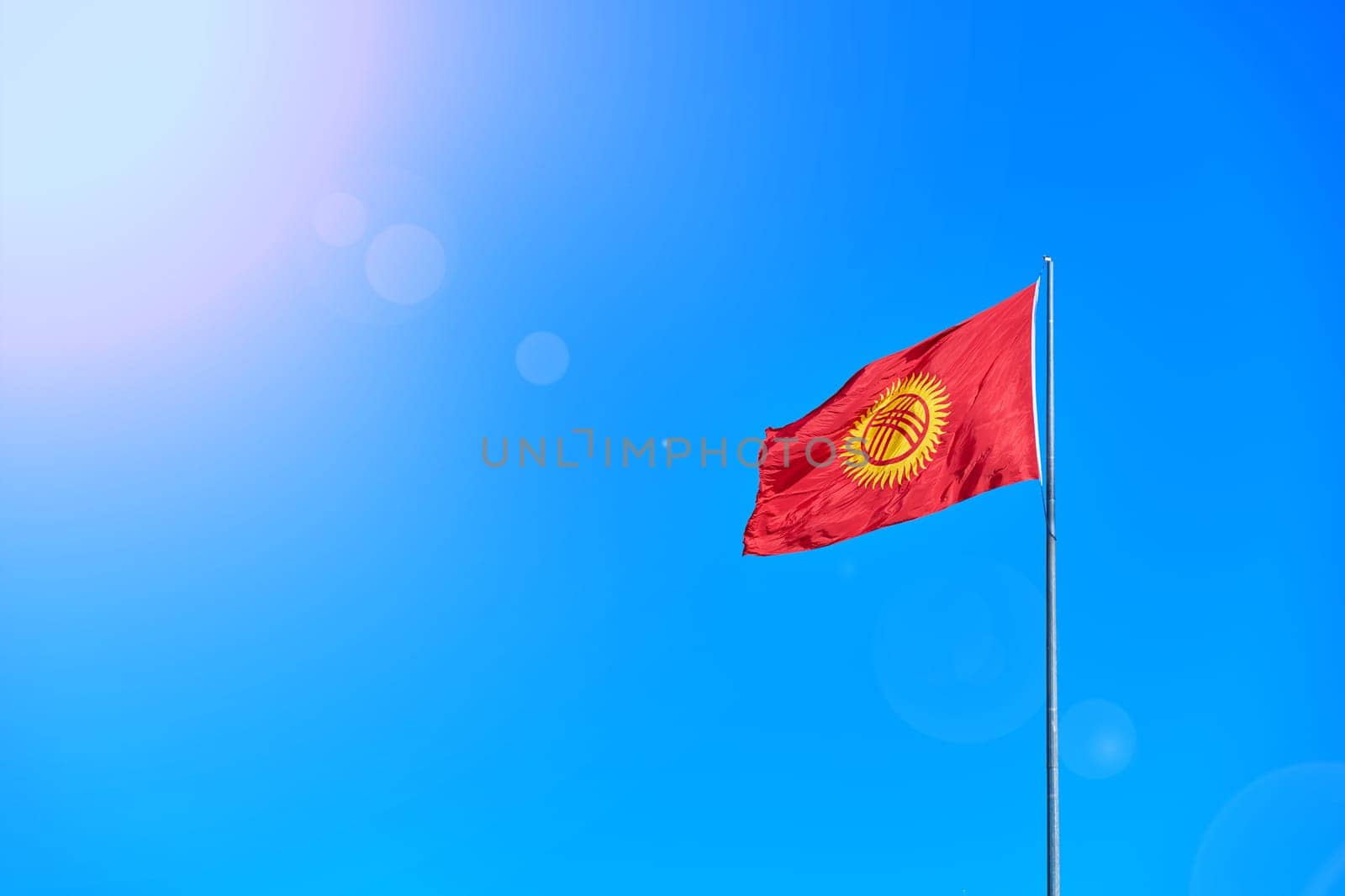 National Kyrgyzstan flag on Bishkek central Ala-Too square.