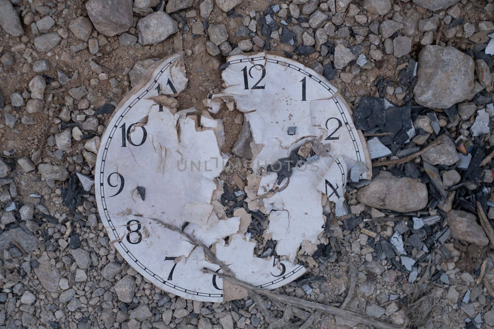 Classic Analog Clock In The Sand On The Rock ground.