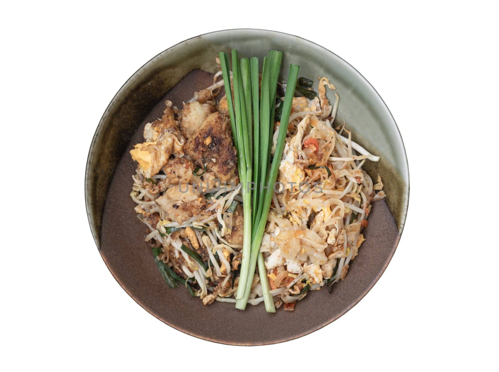 Traditional Fried Thai Noodle (pad thai) and Stirred fried turnip cake or Fried radish cake (chai tow kway) on Ceramic plate isolated on white background with clipping path. Top view, Selective focus.