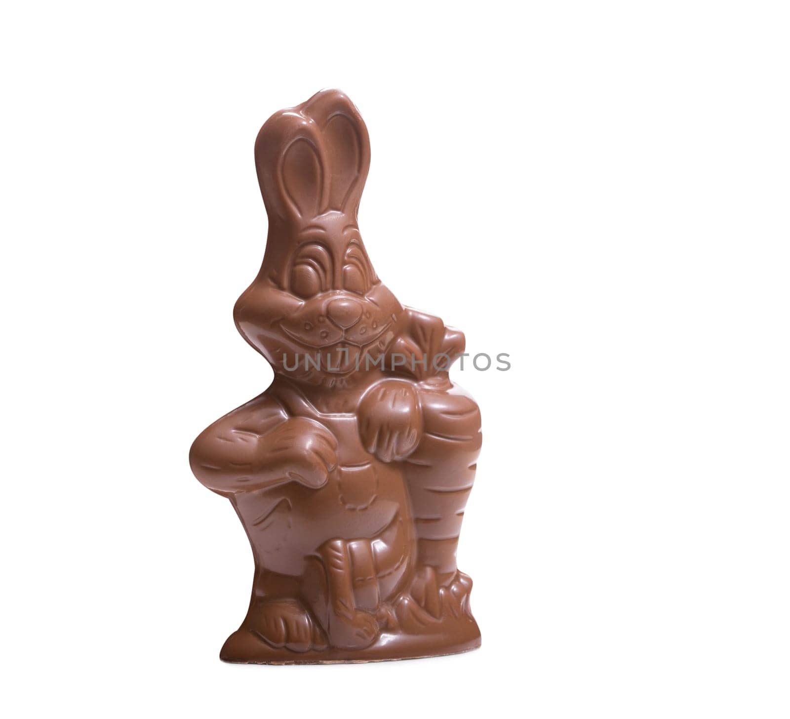 Chocolate bunny with carrot, isolated on white background