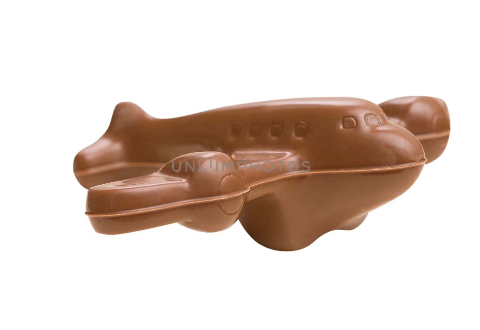 Airplane made of tasty milk chocolate, isolated on white