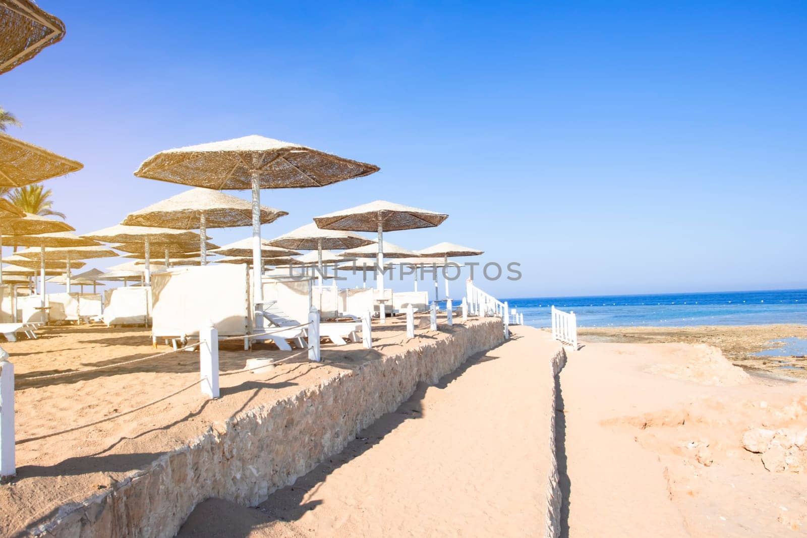 Sunny beach with wonderful sand coast and view on sea.