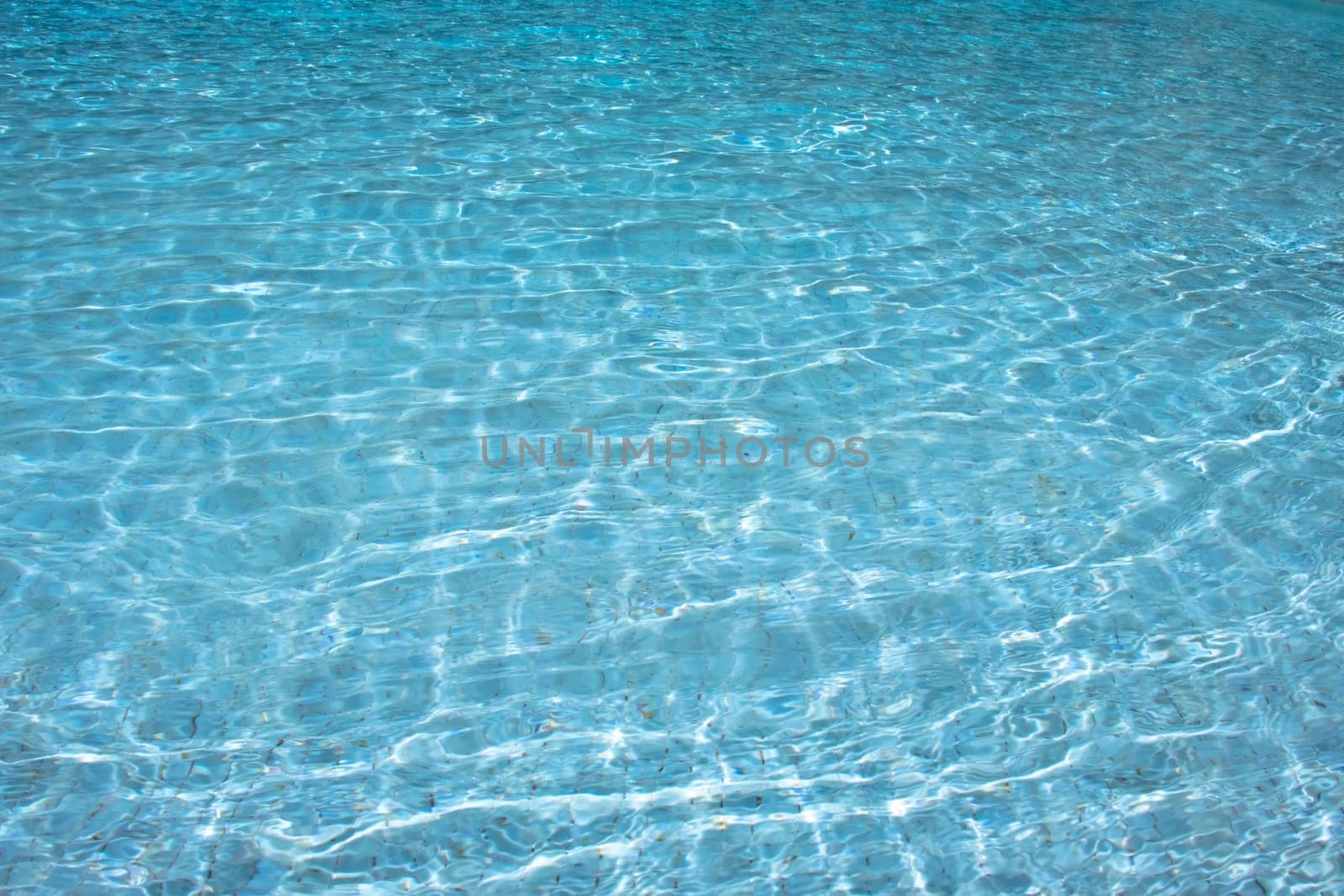 Clear blue water with ripples, presenting a tranquil and peaceful aquatic scene.