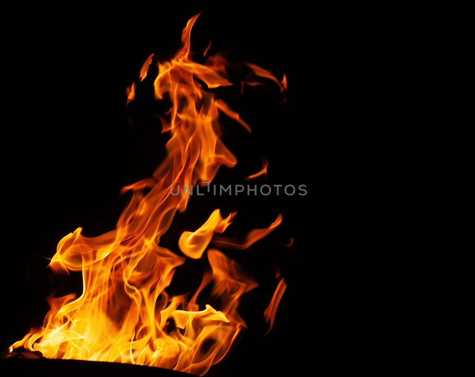 Decorative background with fire flames on black with copy space