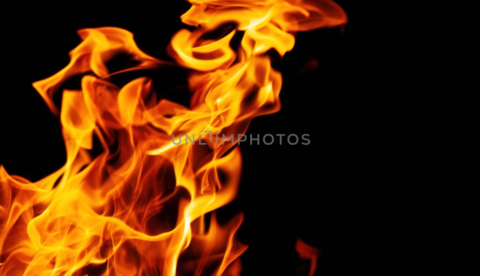 Decorative background with fire flames on black with copy space