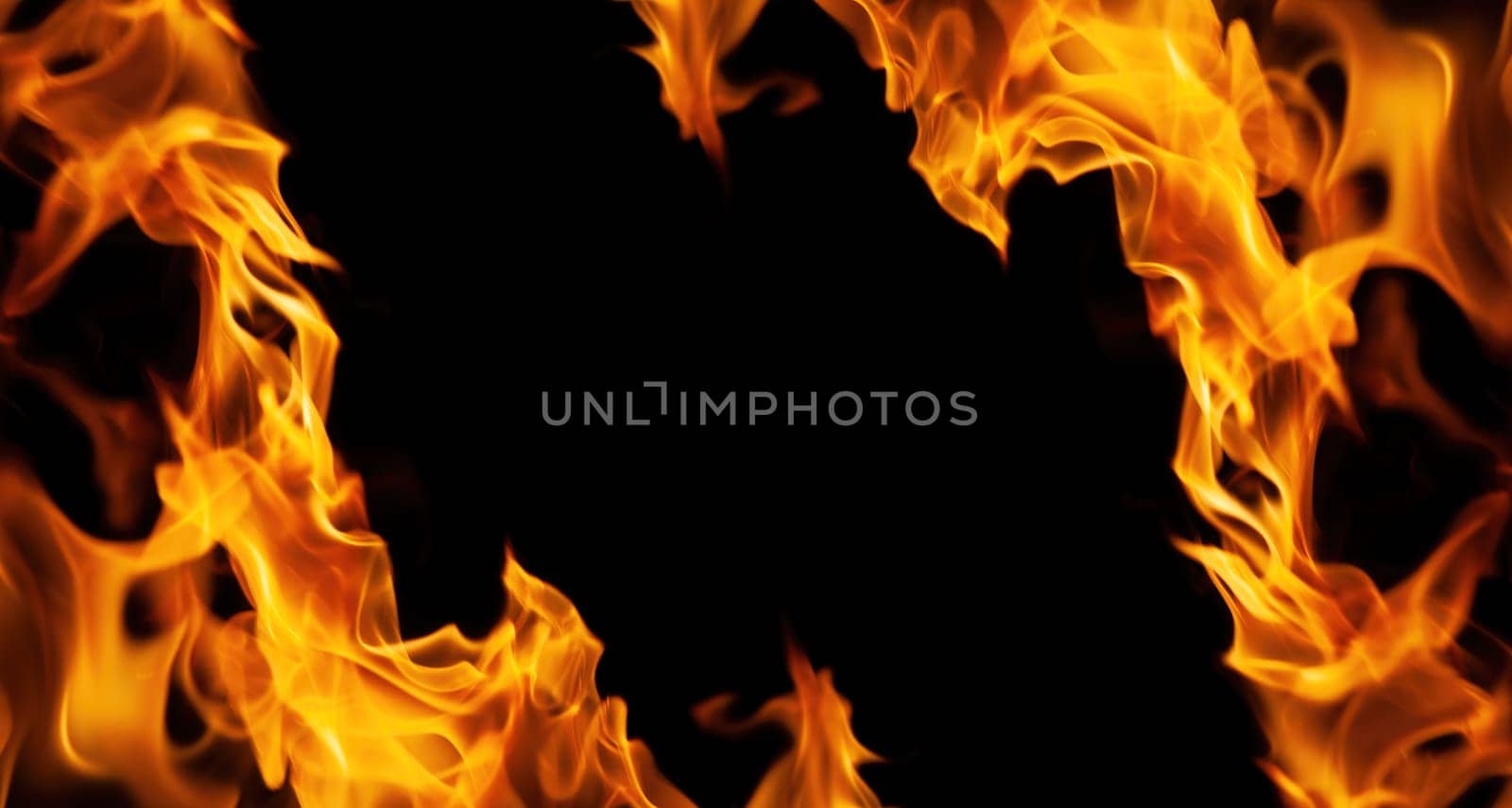 Decorative background with fire flames on black with copy space