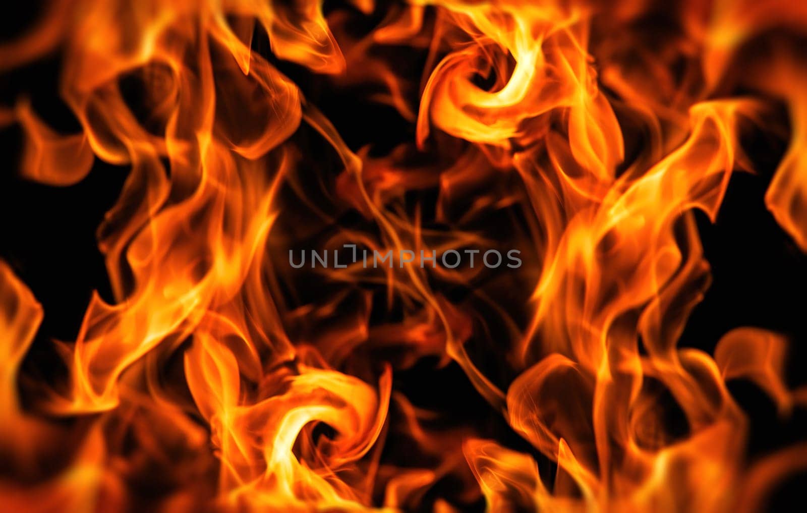 Decorative background with fire flames on black with copy space