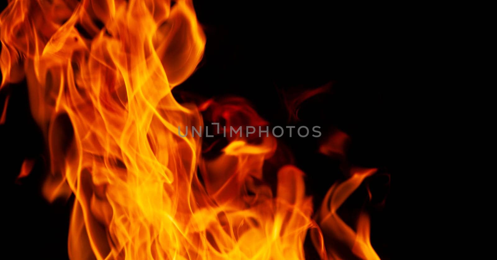 Decorative background with fire flames on black with copy space