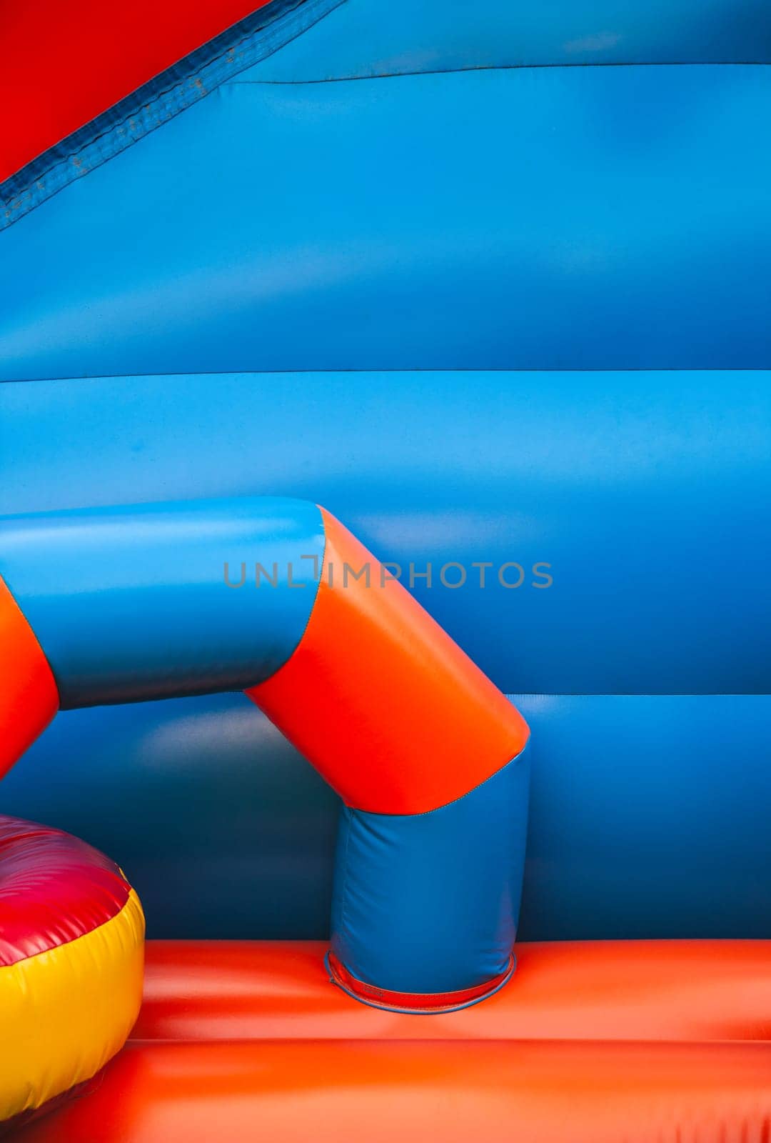 Abstract background and texture of a bright colourful plastic playground for playtime