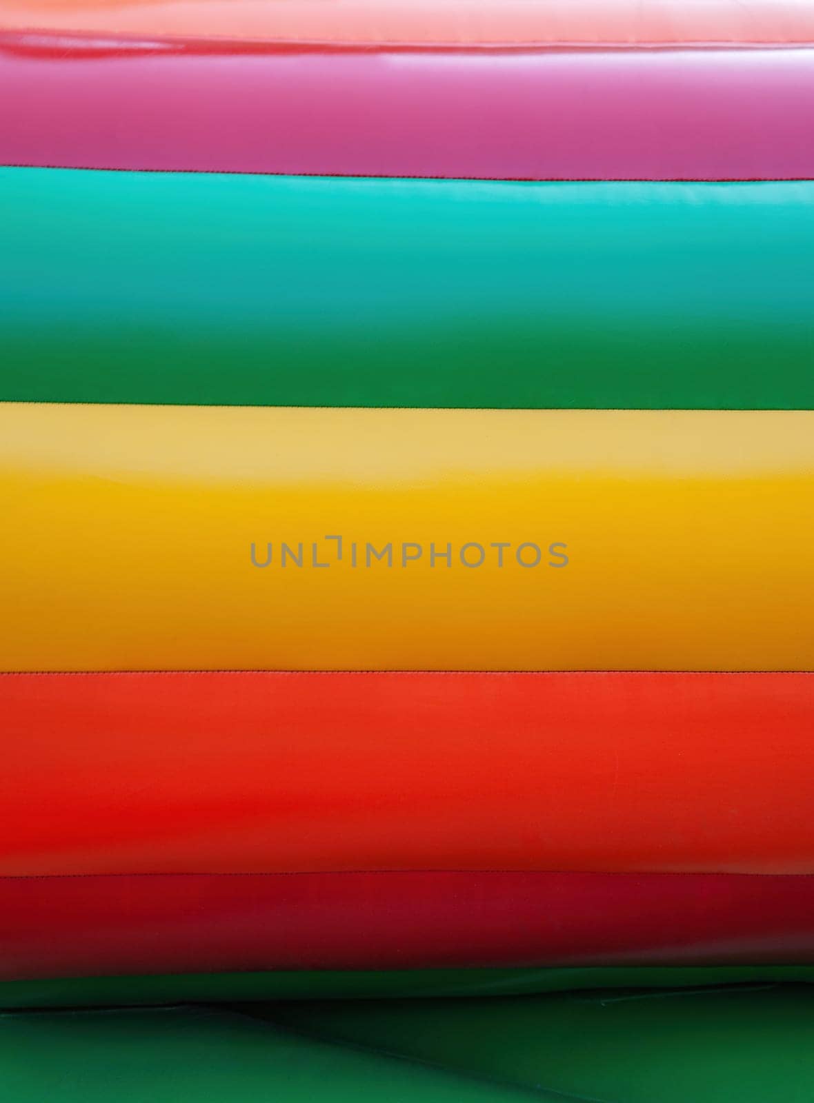 Abstract background and texture of a bright colourful plastic playground for playtime