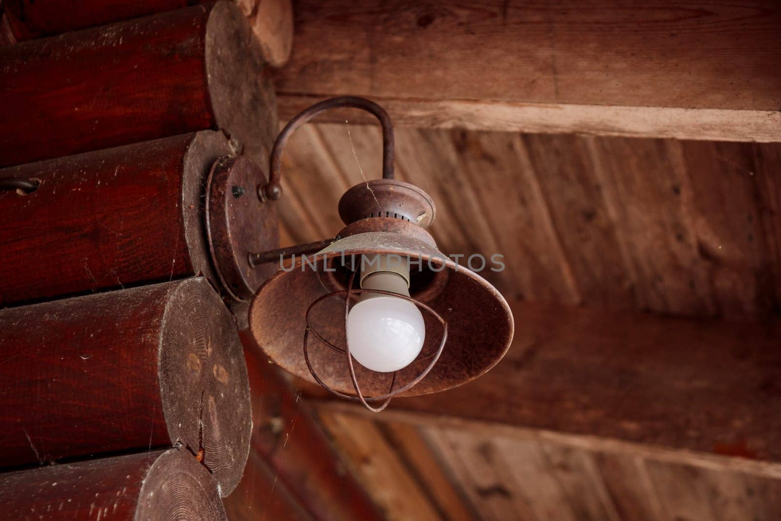The old kerosene lamp on a wooden floor, old gray cement backdrop, banner with copyspace