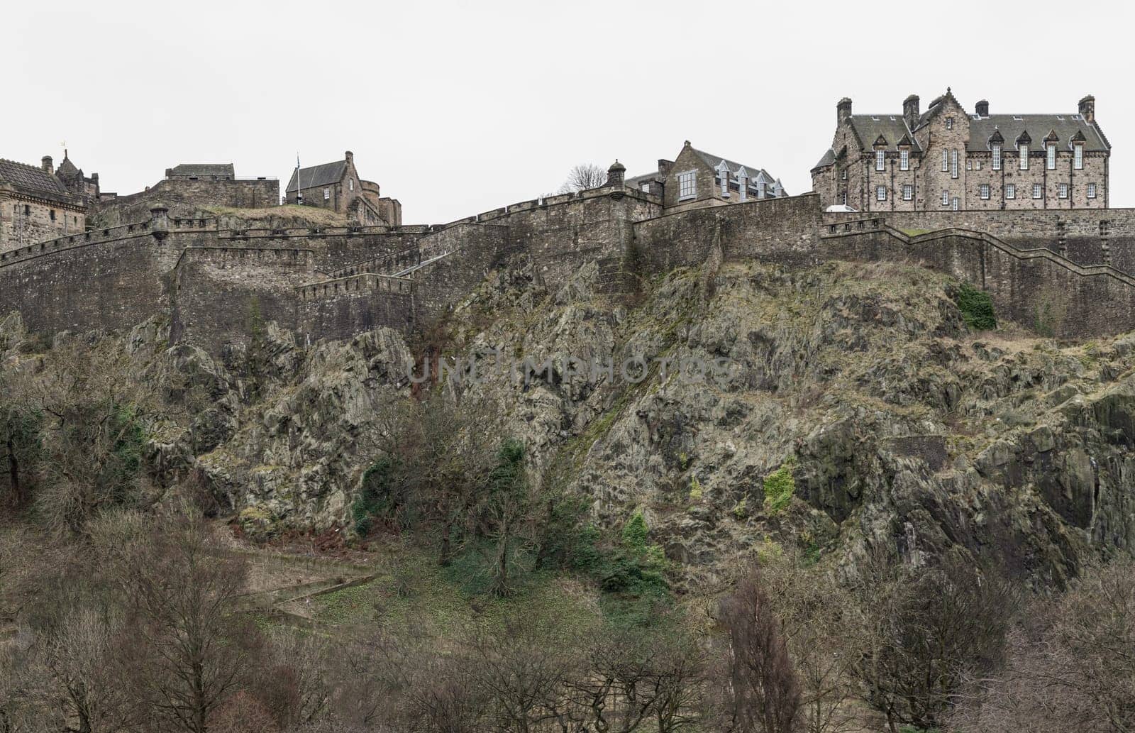 Edinburgh, Scotland - Jan 16, 2024 - Scenic view of Edinburgh Castle at the top of the hill is a historic fortress and is one of the most popular tourist attractions in Edinburgh city. Copy space, Selective focus.