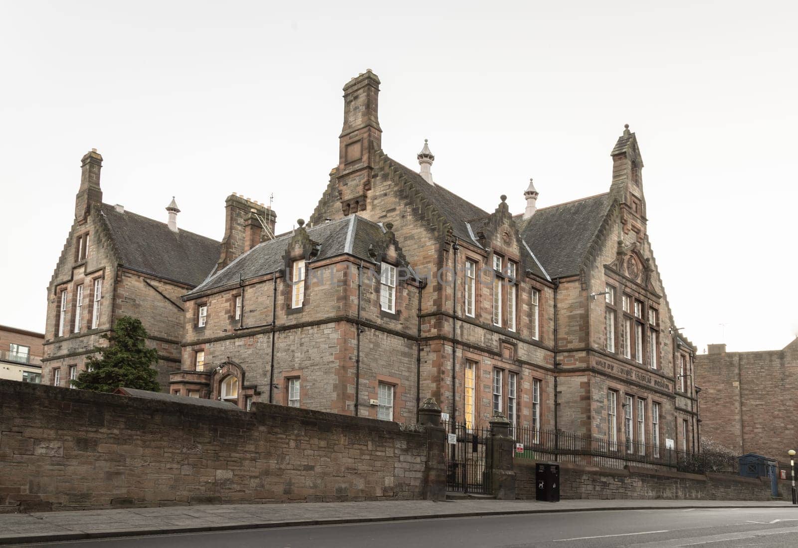 Edinburgh, Scotland - Jan 17, 2024 - Exterior view of the Milton House Public School or Royal Mile primary school on Royal Mile in the Old Town of Edinburgh city. Space for text, Selective focus.