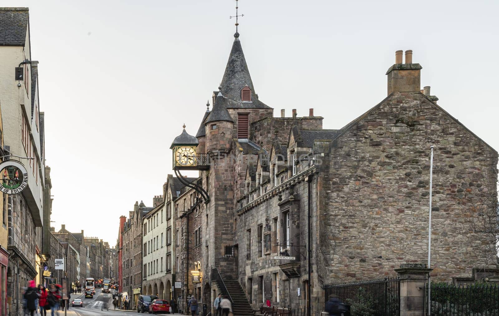 Edinburgh, Scotland - Jan 17, 2024 - Clock tower of the famous Canongate Tolbooth (The Tolbooth Tavern) is a historic landmark on Royal Mile in the Old Town of Edinburgh city. Space for text, Selective focus.