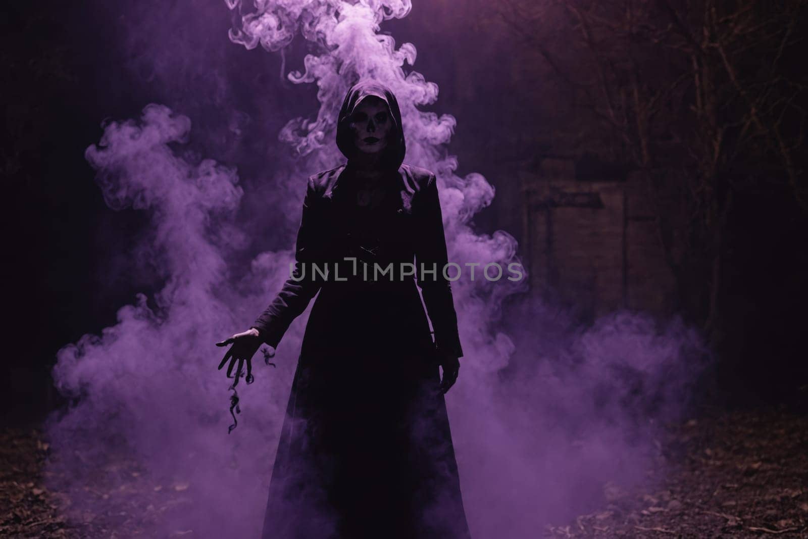 Mysterious cloaked person with glowing eyes, enveloped in purple smoke, perfect for horror and thriller themes.