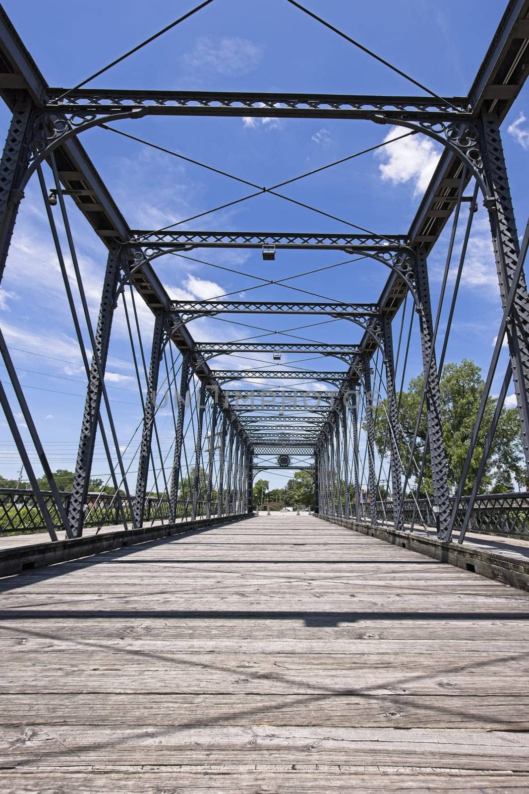 The old Wells Street Bridge on a bright day in downtown Fort Wayne, Indiana.