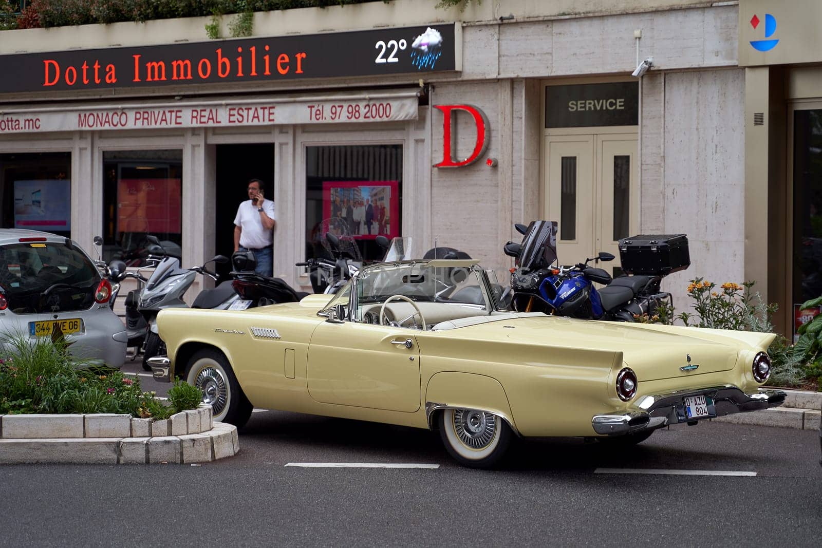 Monte Carlo, Monaco - June 14, 2023: Beige vintage Ford Thunderbird aka T-Bird, a personal luxury car manufactured and marketed by Ford Motor Company circa 1957 parked on the street