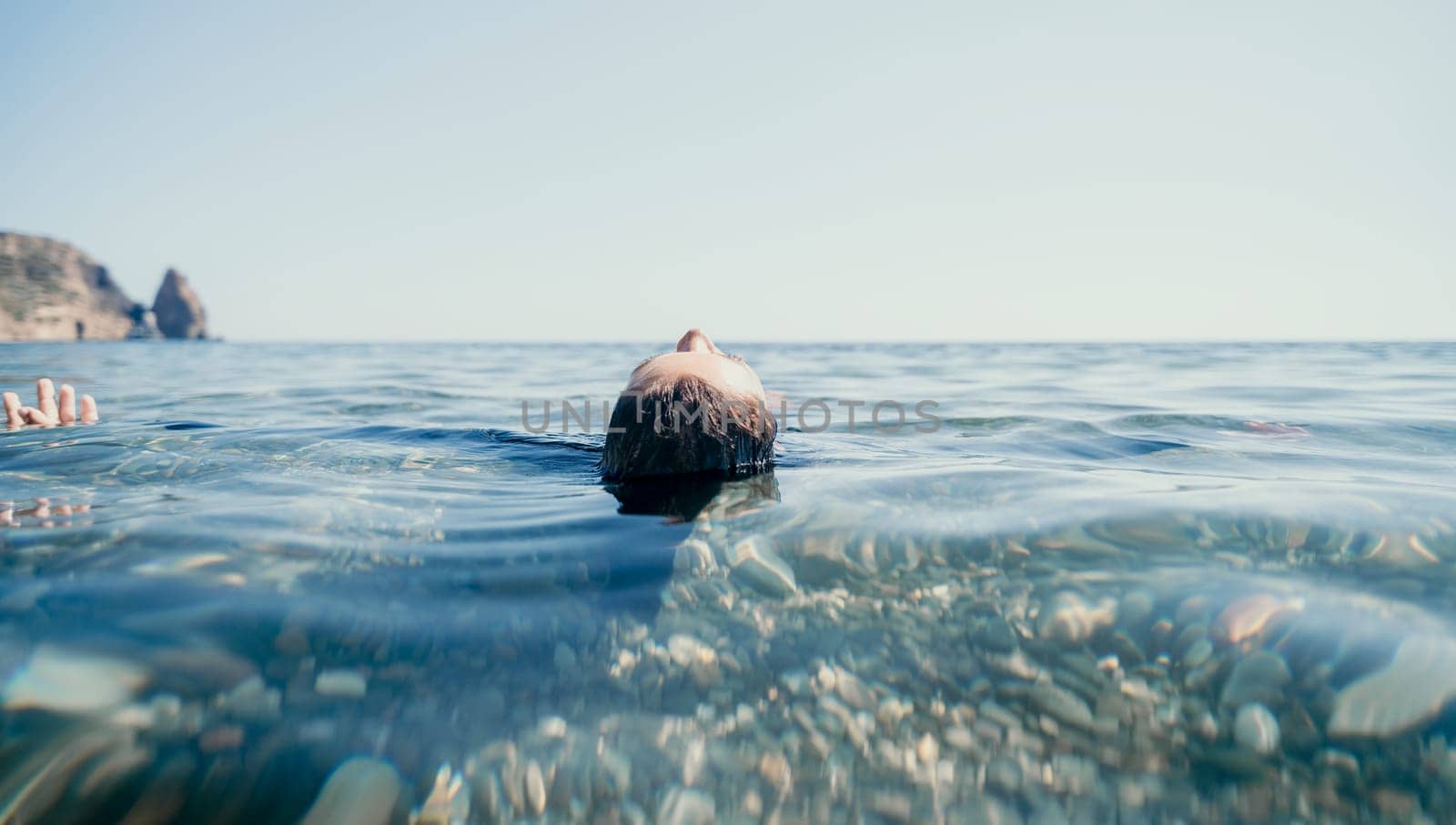 Weight loss and body image concept. Woman with perfect fit body walking confident on beach. Unrecognizable sexy young woman.