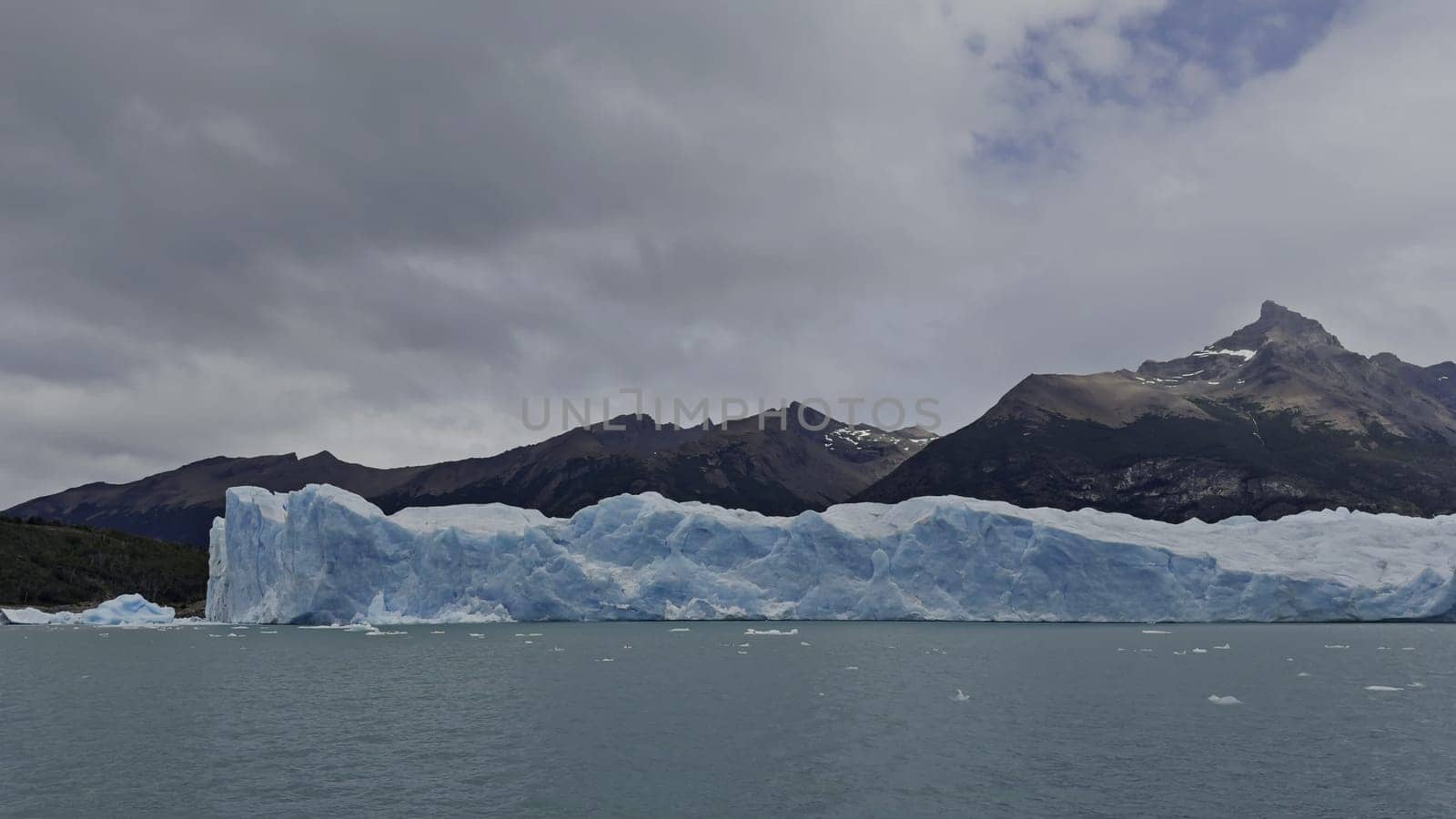 Boat trip footage showcasing the sheer cliffs of Perito Moreno Glacier, highlighting nature's majesty.