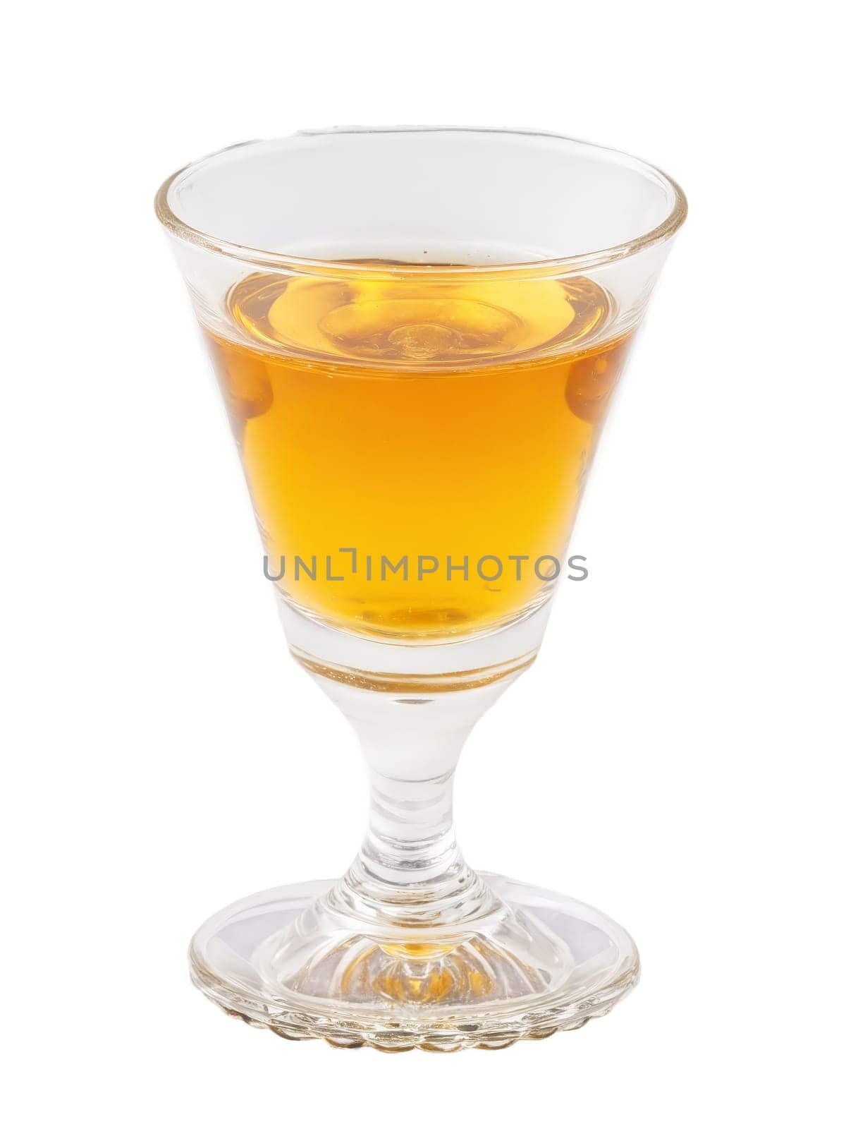 Czech Becherovka Shot of herbal bitter liqueur in shot glass deep amber in color. Drink isolated on transparent background.