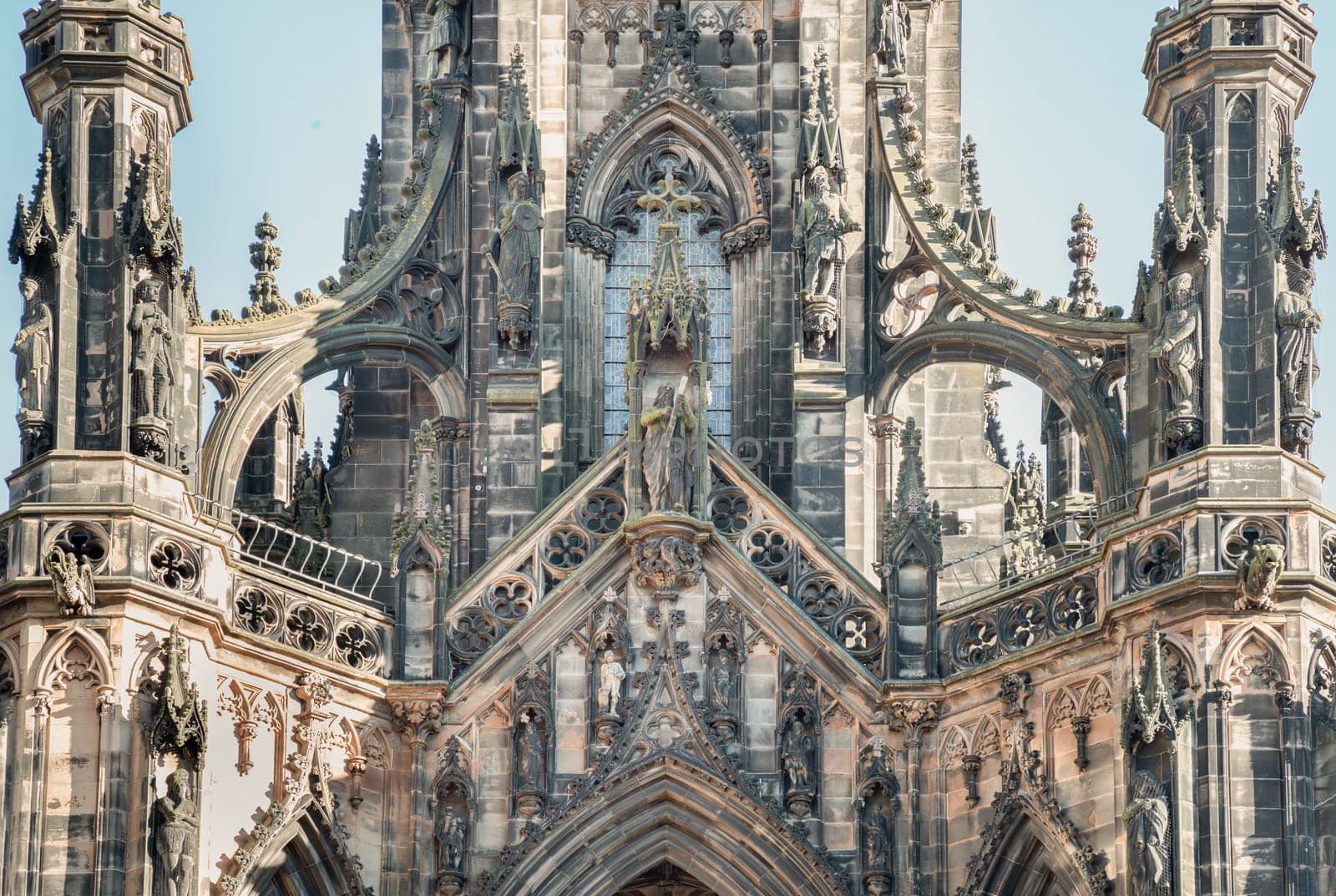 Edinburgh, Scotland - Jan 16, 2024 - The architectural details of The Scott Monument and spire is a Victorian Gothic monument to Sir Walter Scott. It is the largest monument to a writer in Princes Street Gardens at the city of Edinburgh. Copy space, Selective focus.